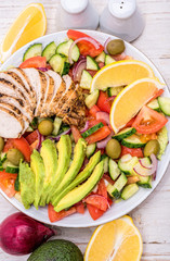 Mediterranean chicken salad with avocado . Concept of cooking.