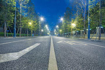 empty asphalt road through modern city in China.