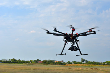 Fototapeta premium flying drone with camera on the sky
