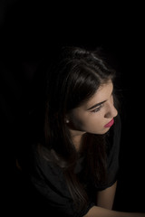Young woman ,studio portrait on black background