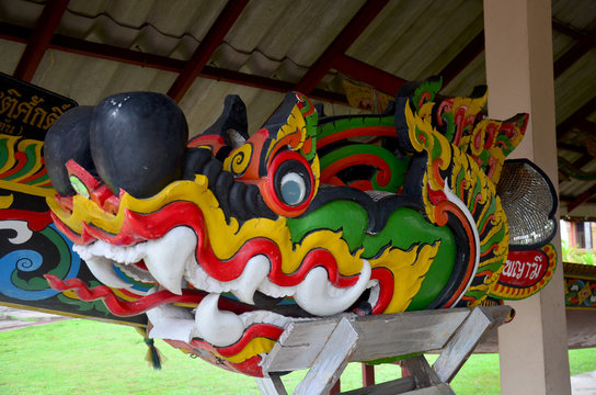 Carving wooden colorful dragon or naga install at head of racing