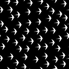 Swallow bird seamless pattern on a black background