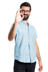 Handsome man making OK sign