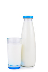 Milk bottle with blue lid, a glass of milk. On white, isolated background.