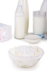 Cottage cheese in a bowl. Dairy products. On white, isolated background.