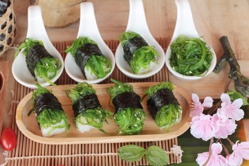 Sushi roll and seaweed salad is delicious.