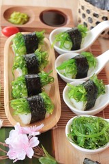Sushi roll and seaweed salad is delicious.