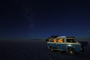 Van and starry sky on Salar de Uyuni, salt lake, is largest salt flat in the world, altiplano, Bolivia, South America