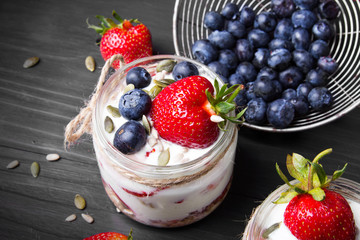 delicious dessert - yogurt with strawberries and blueberries