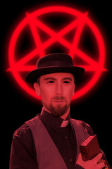 Satanic priest with book on red pentagram background
