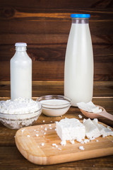 Dairy products. On wooden background.