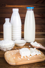 Dairy products. On wooden background.