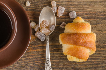 croissant and coffee cup on table