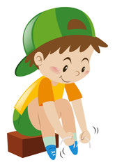 Boy tiding his shoelaces