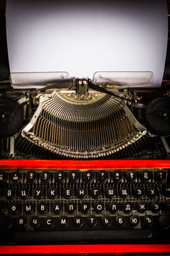 Typewriter. On wooden background.