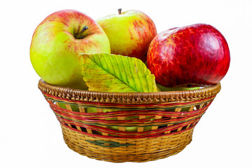 Fresh apples in a basket isolated on a white background
