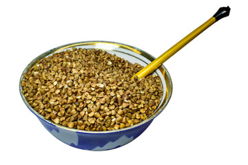 Buckwheat on a plate with spoon isolated on a white background