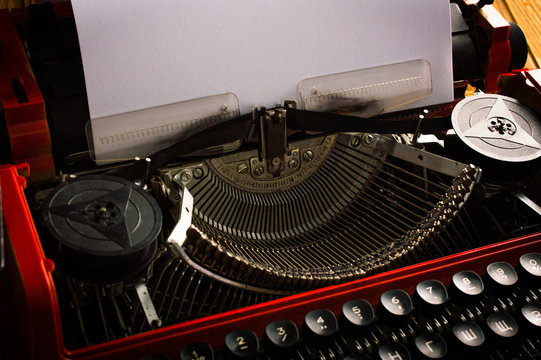 Typewriter. On wooden background.