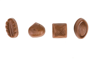 Chocolate candies. On white, isolated background.