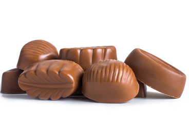 Chocolate candies. On white, isolated background.