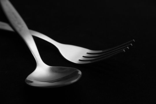 Fork And Spoon Isolated On Black Background