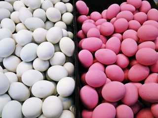White eggs (Salted eggs) and Pink eggs (Preserved eggs or Century eggs) in the market