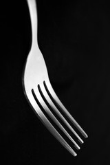 fork isolated on black background