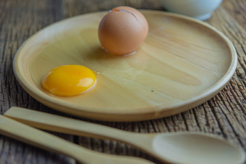 Fresh eggs on the wood plate