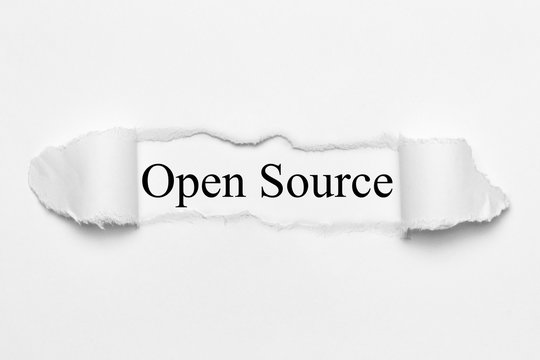 Open Source on white torn paper