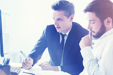 Man taking notes, businessman is thinking