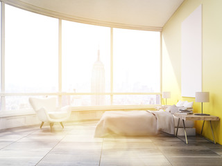 Side view of sunlit bedroom with yellow walls in New York