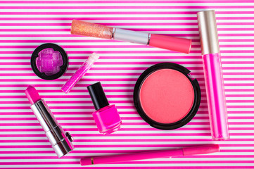 Cosmetics set on on a pink background