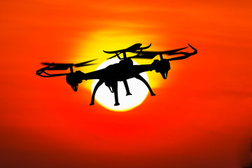 Fototapeta na wymiar Drone flying in sunset landscape