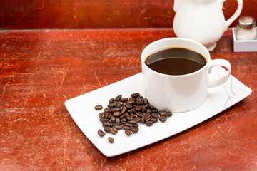 Black coffee on the wooden floor