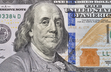 One hundred dollar bill fragment closeup
