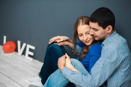 love couple sitting on the floor in the room