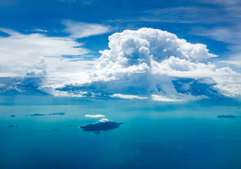 Fototapeta na wymiar Cloud and ocean with island, aerial view