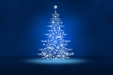 Christmas tree from snowflakes on an abstract blue background