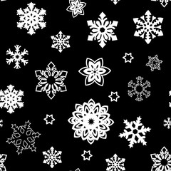 Christmas seamless pattern of small and big snowflakes, white on black. white silhouette