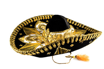 Black with gold ornate trim Mexican hat, sombrero isolated on white background