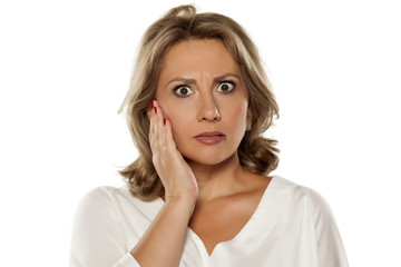 middle-aged unpleasantly surprised woman