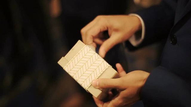 Man opens present box a