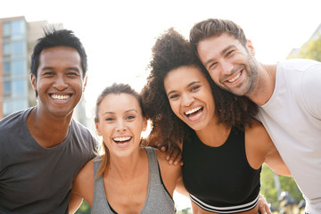 Group of atheltic people having fun together on running session