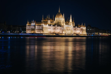 Fototapeta na wymiar View of the Parliament in Budapest nicely illuminated at night
