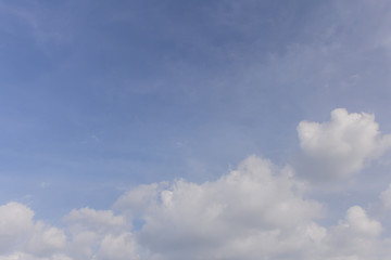 soft white clouds against blue sky background.