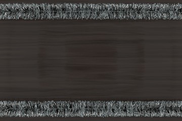 Silver Tinsel on a wood background