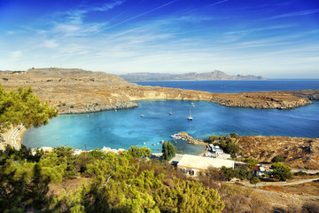 Fototapeta na wymiar Beautiful sea landscape, green hills, blue sky and azure water.