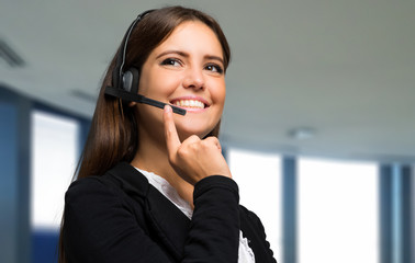 Portrait of a beautiful woman wearing headset