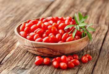 Goji berries on a wooden background