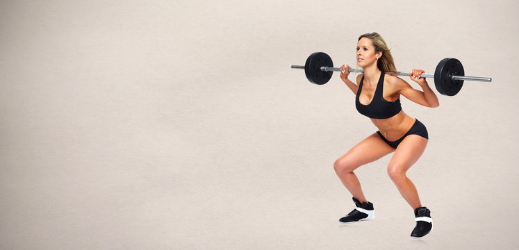 Woman squat barbell.